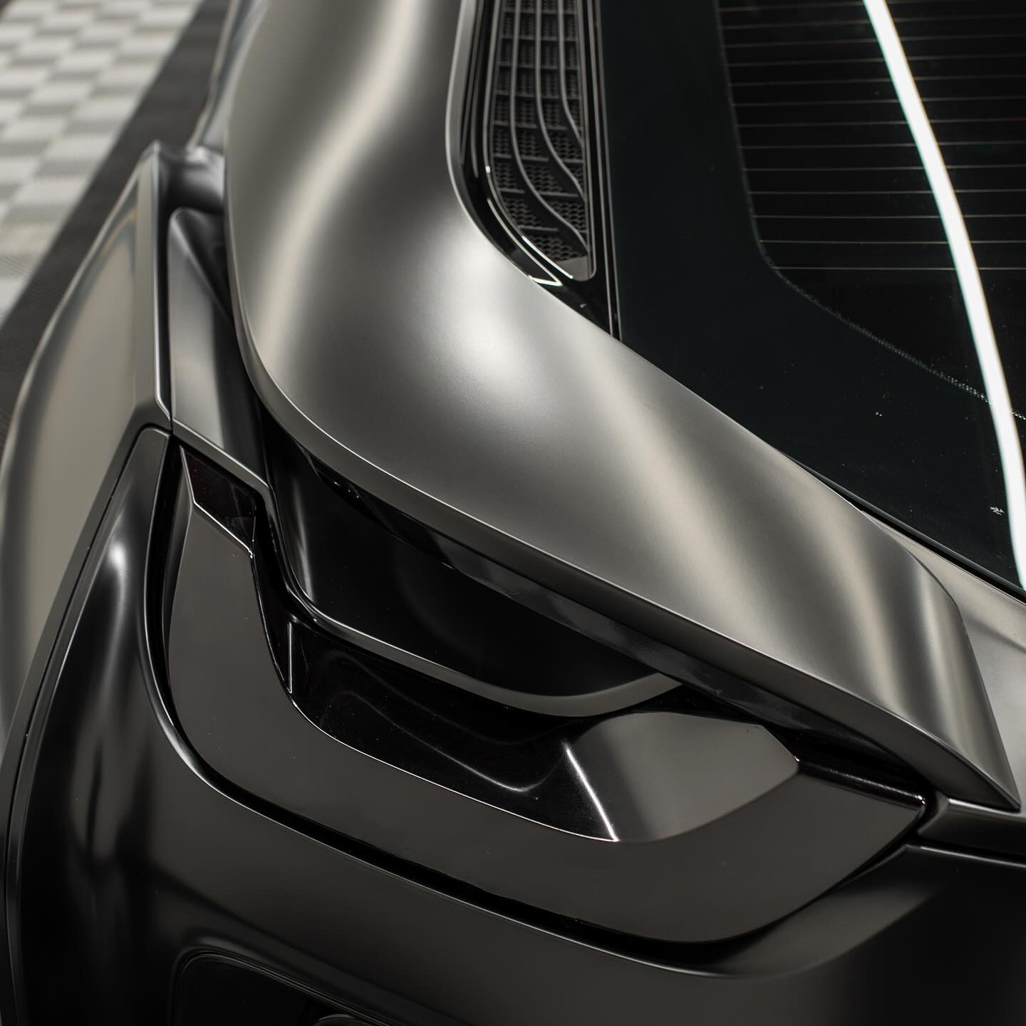 Background of a BMW i8 with a tinting job completed by Wrap Daddy's