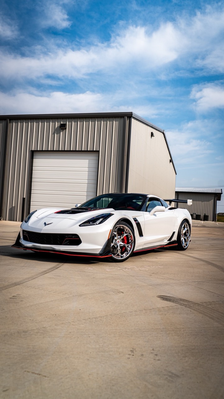 Factory Metallic Royal Blue replaced with full-body Diamond Pearl White color PPF, delivering a clean color transformation with added impact protection. Installed edge-to-edge with seamless execution. Red stripes and smoked headlights retained for aggressive contrast.