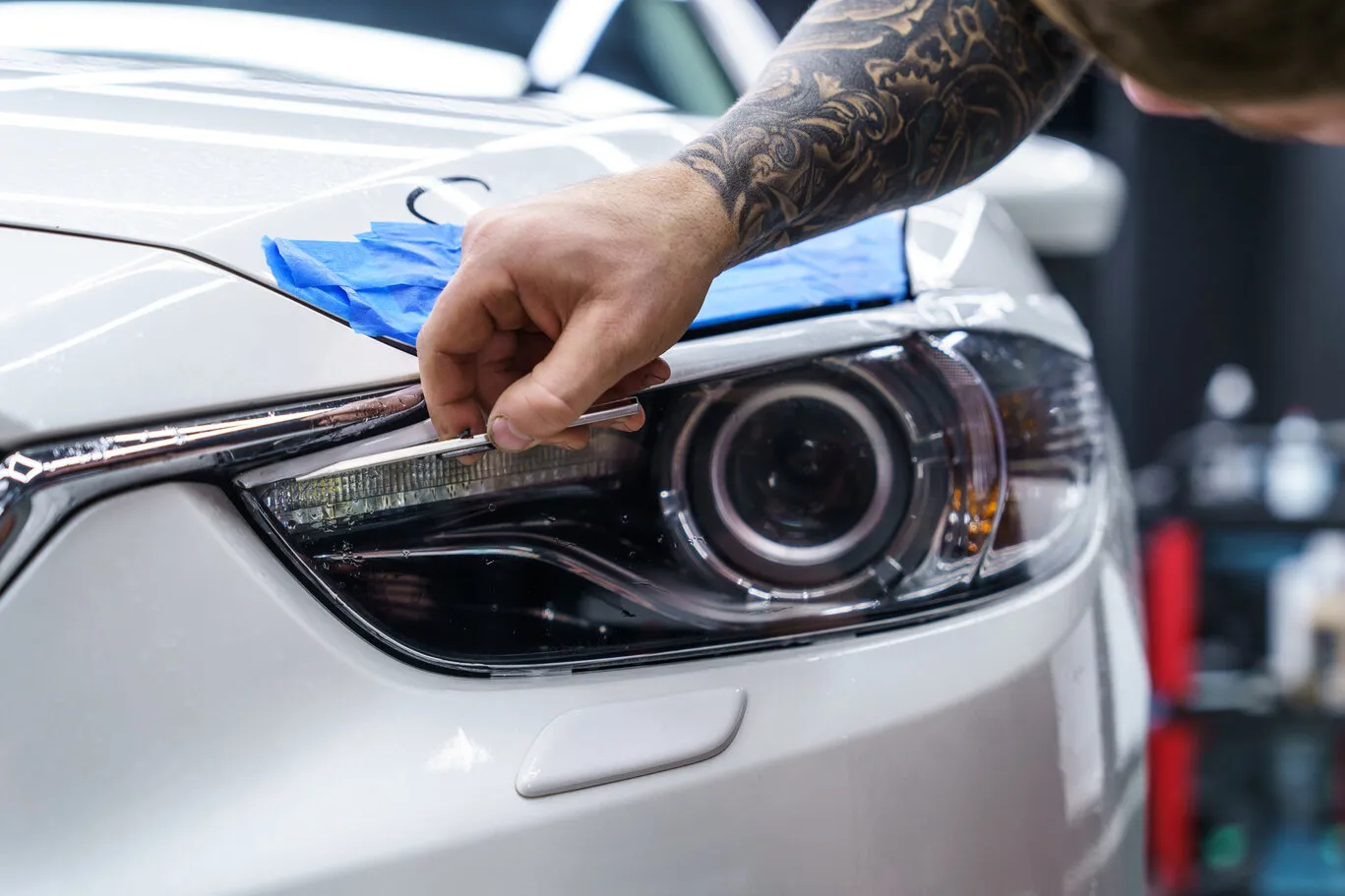 A vehicle's headlight getting ready for tinting